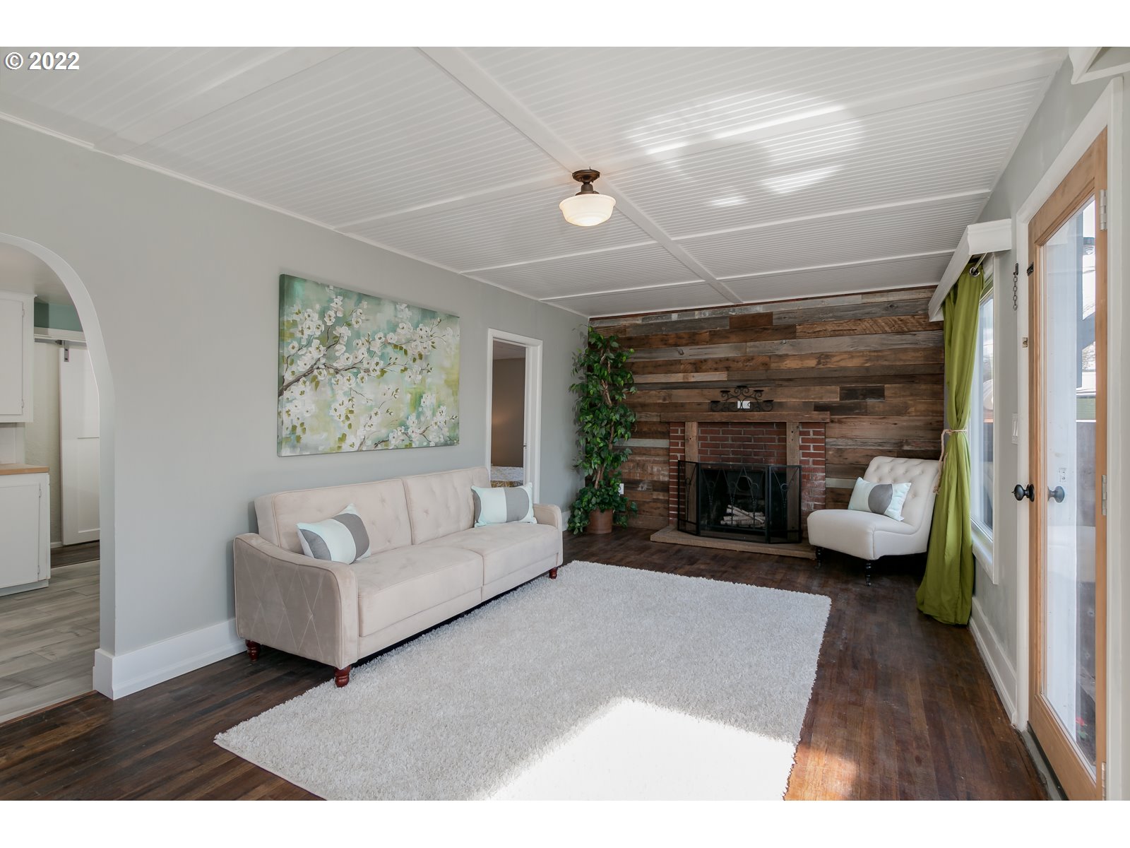 428 18th Street Springfield, OR 97477 - Photo 5 of 22 a living room with furniture and a fireplace