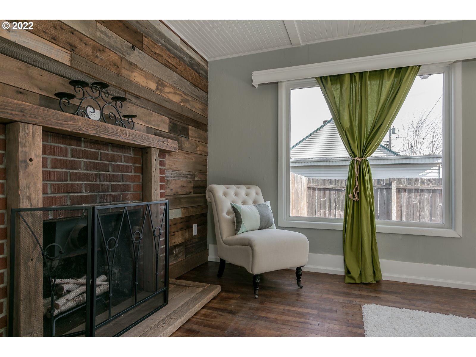 428 18th Street Springfield, OR 97477 - Photo 6 of 22 a living room with furniture a window and a fireplace