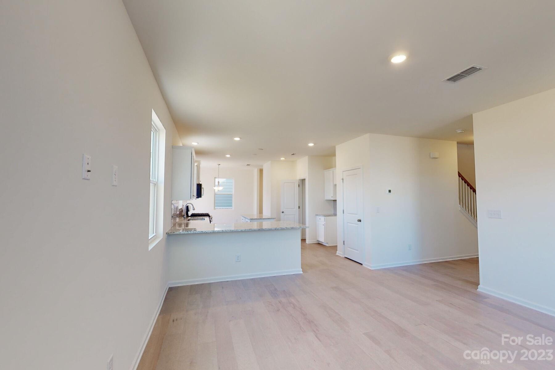 2650 Trinity Street Monroe, NC 28110 - Photo 12 of 36 a view of a kitchen with a sink and a refrigerator