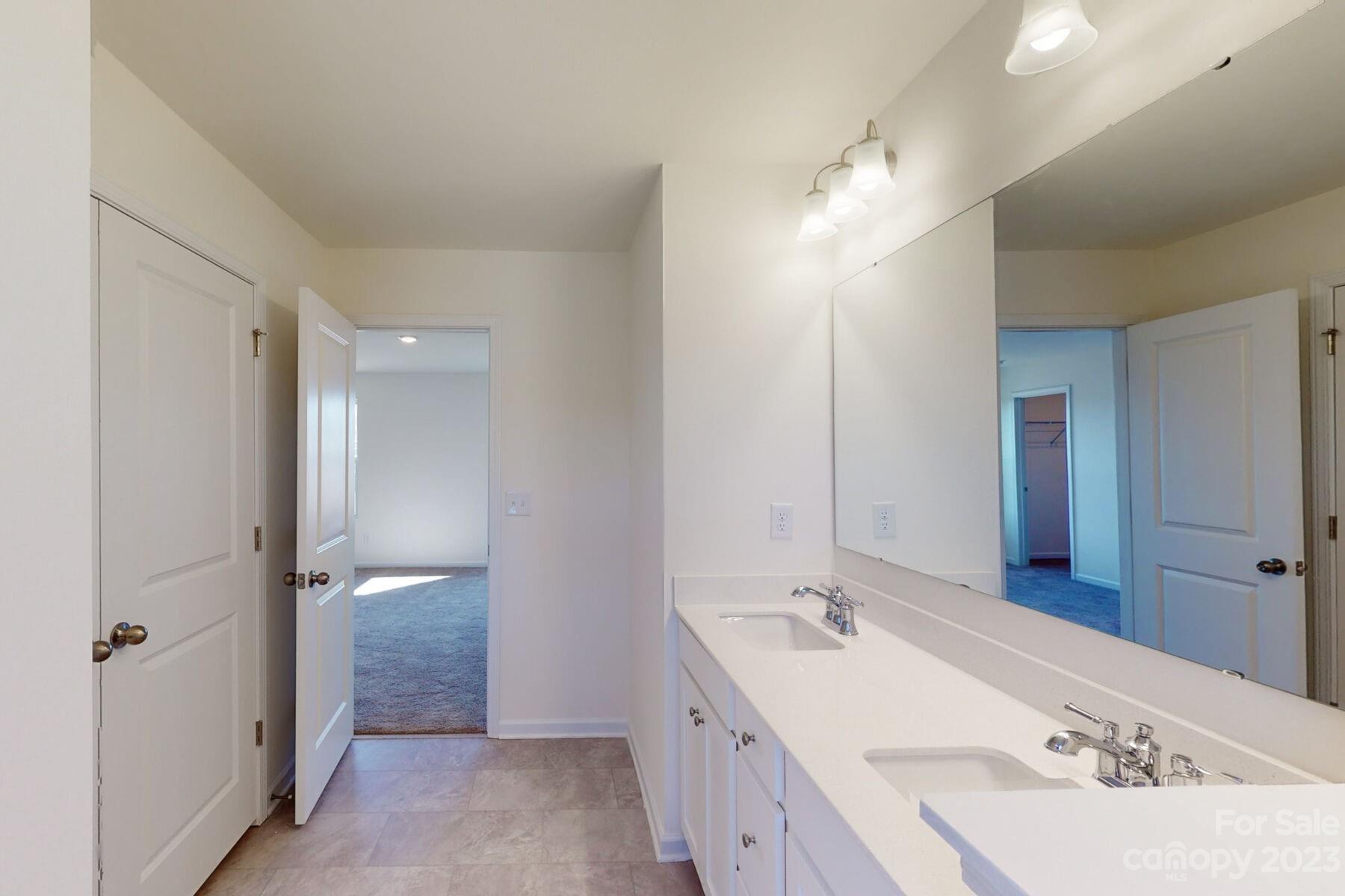 2650 Trinity Street Monroe, NC 28110 - Photo 26 of 36 a bathroom with a double vanity sink mirror and double