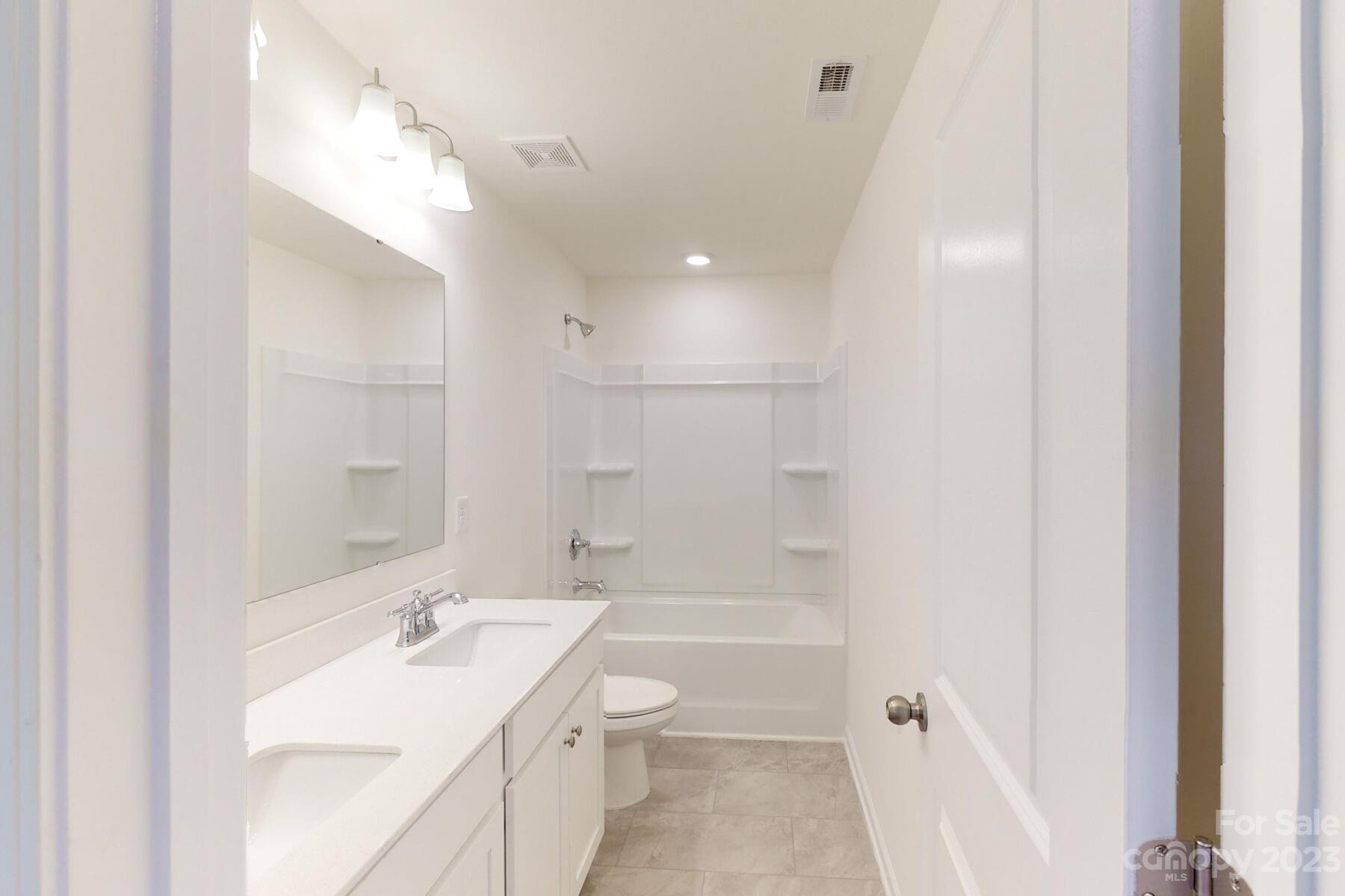 2650 Trinity Street Monroe, NC 28110 - Photo 30 of 36 a bathroom with a sink a toilet and shower