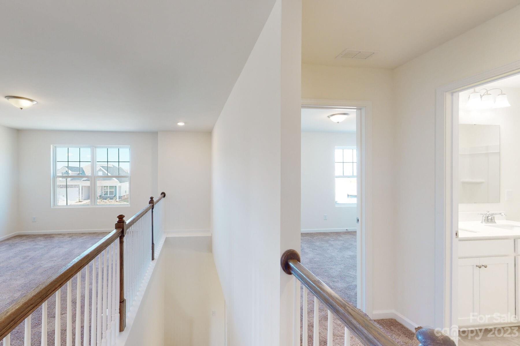 2650 Trinity Street Monroe, NC 28110 - Photo 34 of 36 a view of a hallway with windows and stairs