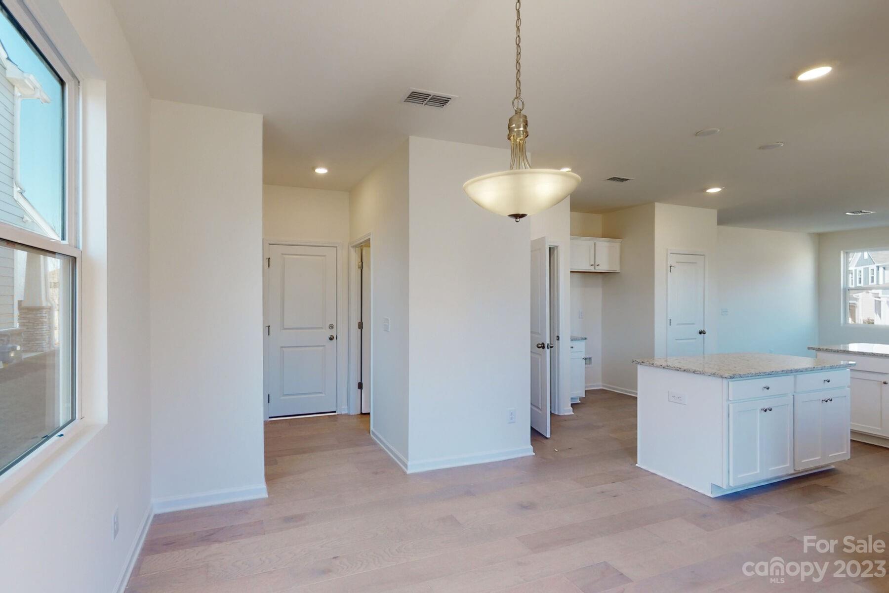 2650 Trinity Street Monroe, NC 28110 - Photo 10 of 36 a view of a kitchen with a sink and a chandelier