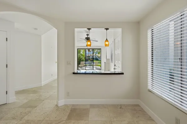 a view of room with window and ceiling fan