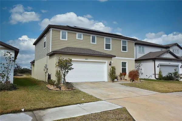 a kitchen with a refrigerator and a sink