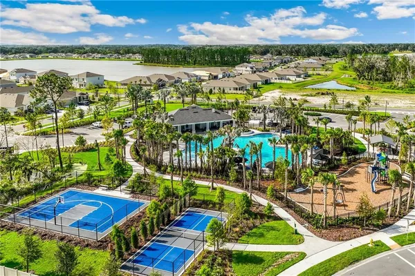 a view of swimming pool with outdoor seating and city view
