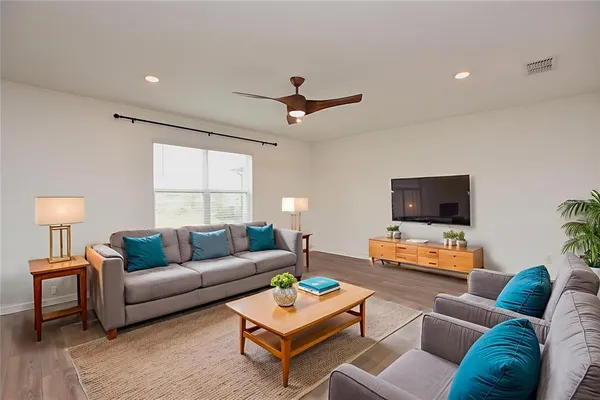a view of a dining room with furniture and chandelier