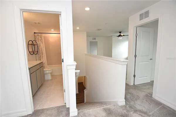 a view of a livingroom with a ceiling fan