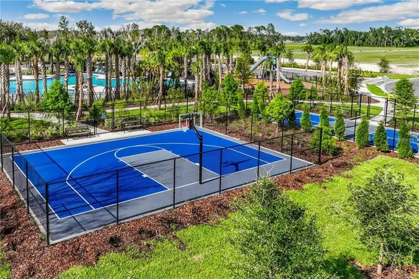 a view of a swimming pool with a yard