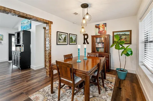 a view of a dining room with furniture and a rug