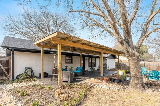 a backyard of a house with seating space