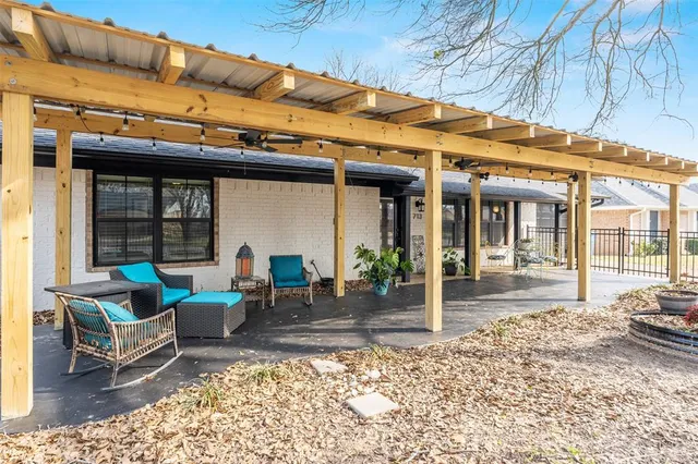 a view of a dinning table and chair in the outdoor space