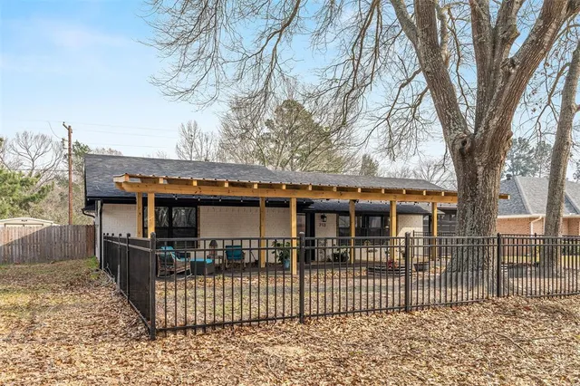 front view of a house with a fence