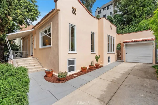 a front view of a house with entertaining space