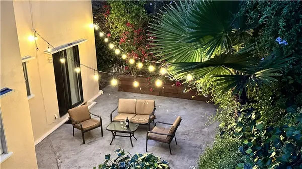 a view of swimming pool outdoor seating and ocean view
