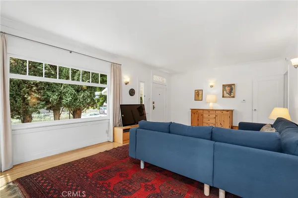 a kitchen with cabinets appliances and a window
