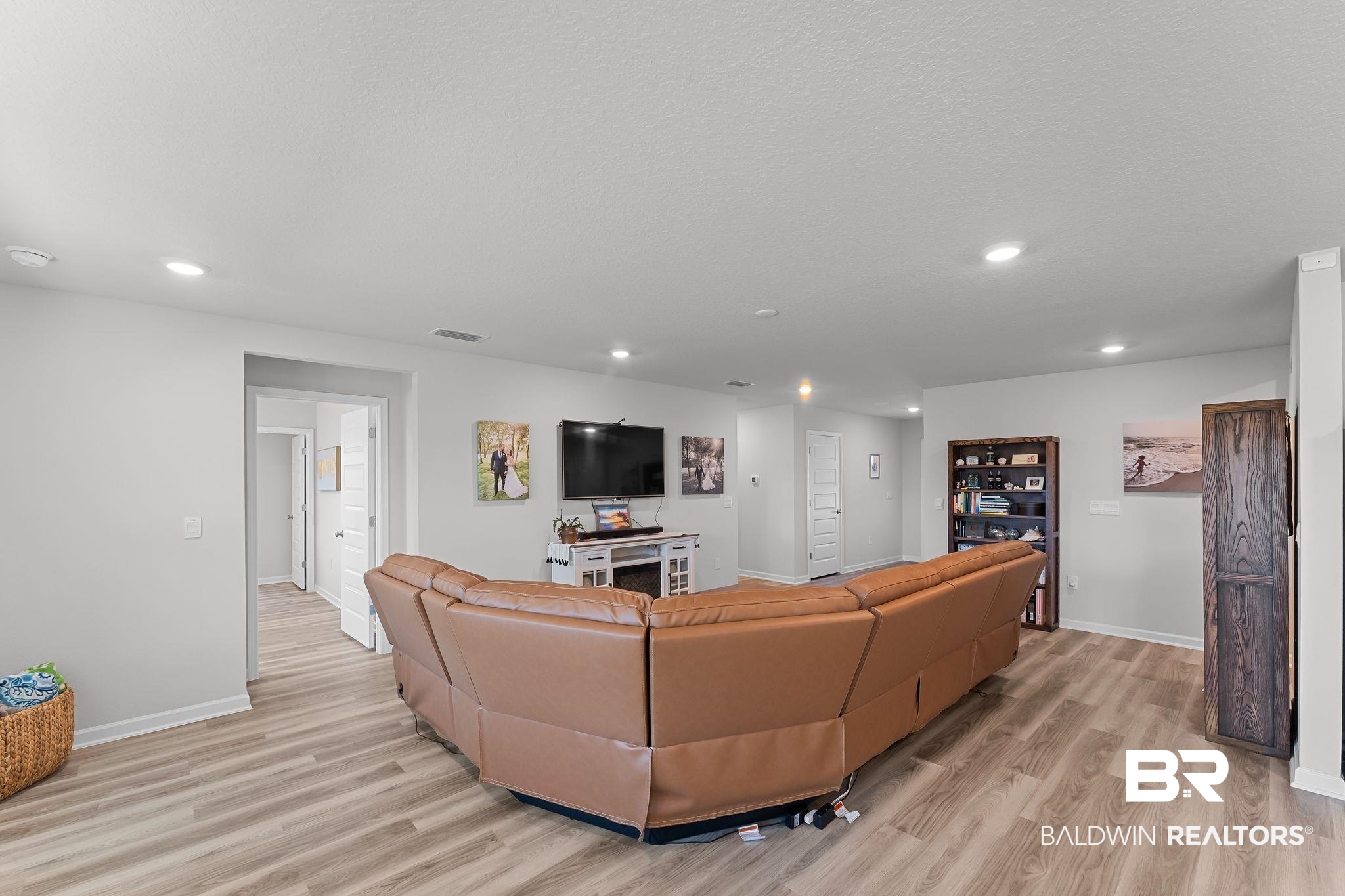 24337 Ringneck Loop Elberta, AL 36530 - Photo 8 of 34 Living room featuring light wood-style flooring and recessed lighting