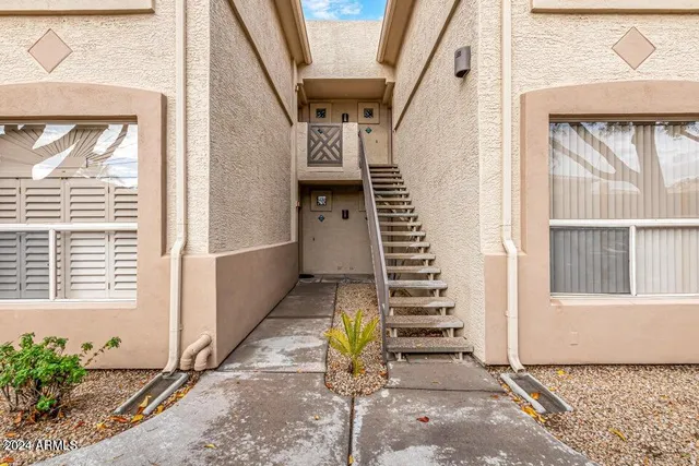 a view of entryway with wooden floor and stairs