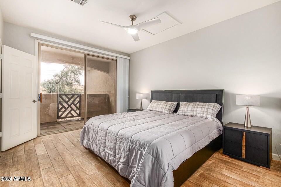 9550 East Thunderbird Road, Unit 266 Scottsdale, AZ 85260 - Photo 17 of 35 a bedroom with a large bed and a lamp