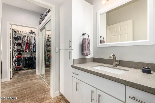 a bathroom with a sink and a mirror