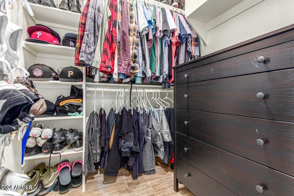 9550 East Thunderbird Road, Unit 266 Scottsdale, AZ 85260 - Photo 22 of 35 a view of walk in closet with clothes and shoes