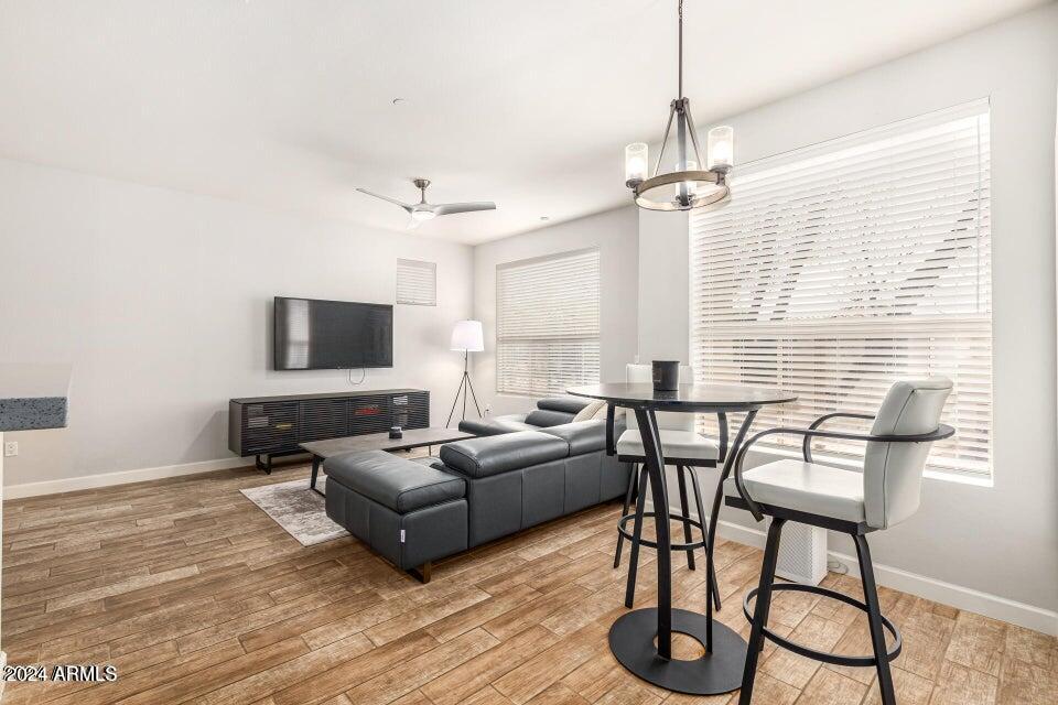 9550 East Thunderbird Road, Unit 266 Scottsdale, AZ 85260 - Photo 4 of 35 a living room with furniture a flat screen tv and a window