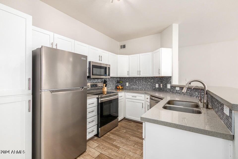 9550 East Thunderbird Road, Unit 266 Scottsdale, AZ 85260 - Photo 7 of 35 a kitchen with a refrigerator sink and microwave