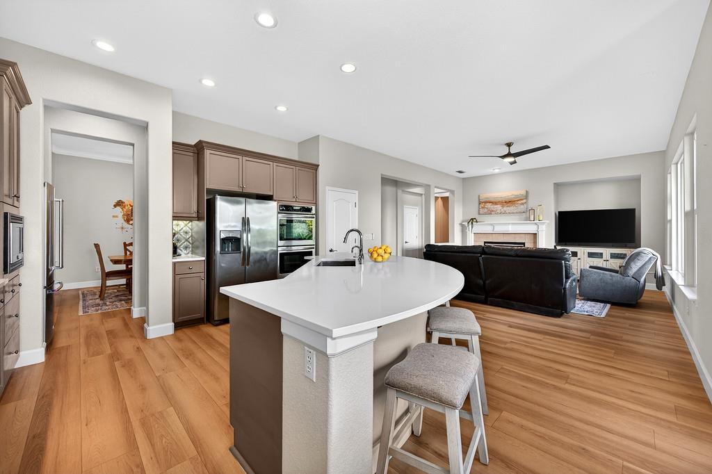 2208 Raintree Court Rocklin, CA 95765 - Photo 12 of 46 a large kitchen with a table and chairs