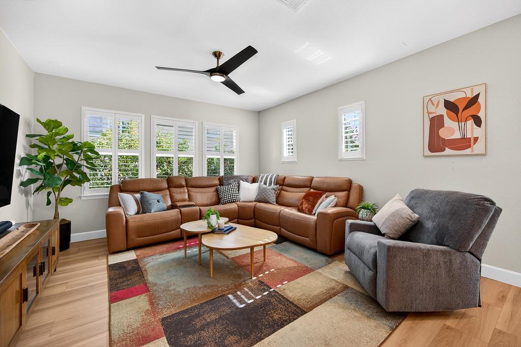 2208 Raintree Court Rocklin, CA 95765 - Photo 22 of 46 a living room with furniture and a flat screen tv