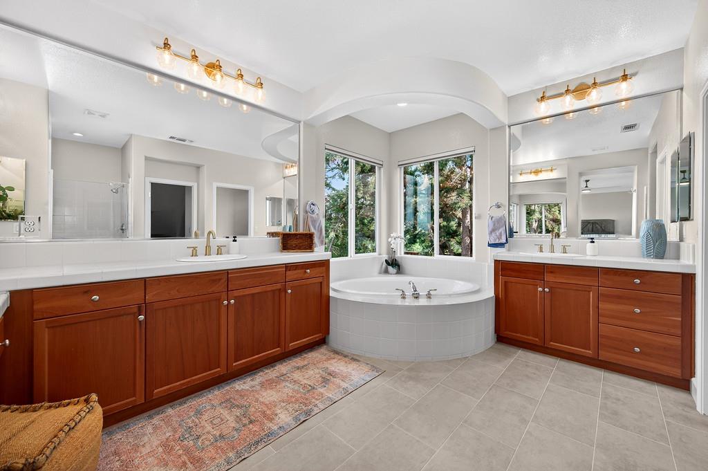 2208 Raintree Court Rocklin, CA 95765 - Photo 27 of 46 a spacious bathroom with a sink mirror and bathtub