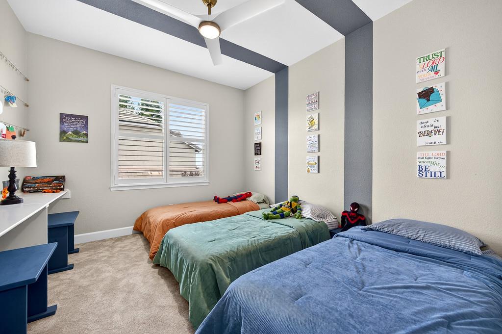 2208 Raintree Court Rocklin, CA 95765 - Photo 28 of 46 a bedroom with two beds and a window