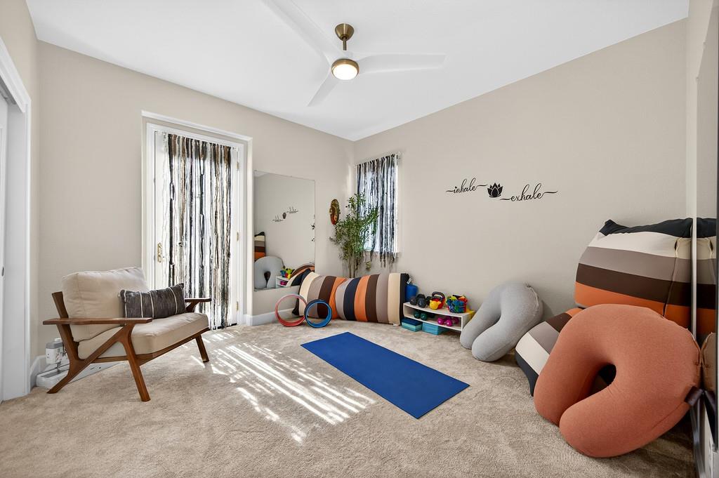 2208 Raintree Court Rocklin, CA 95765 - Photo 29 of 46 a living room with furniture and a lamp
