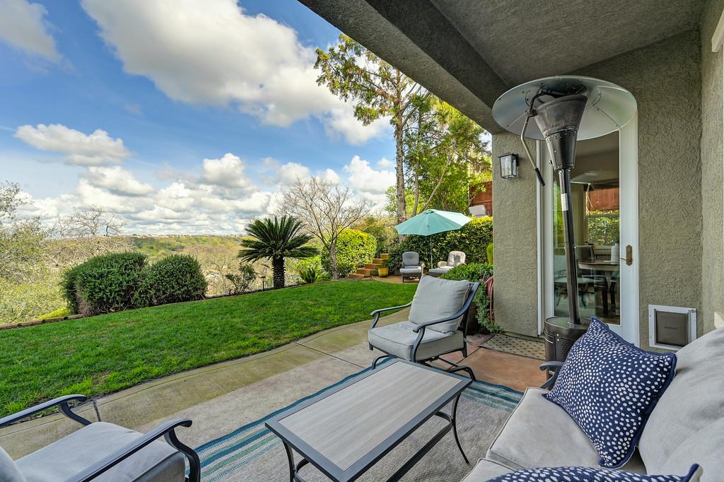 2208 Raintree Court Rocklin, CA 95765 - Photo 35 of 46 a view of a patio with chair and tables