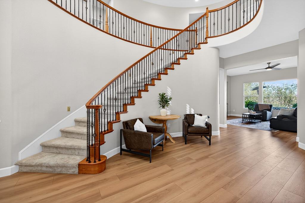 2208 Raintree Court Rocklin, CA 95765 - Photo 5 of 46 a view of entryway livingroom and hall with wooden floor