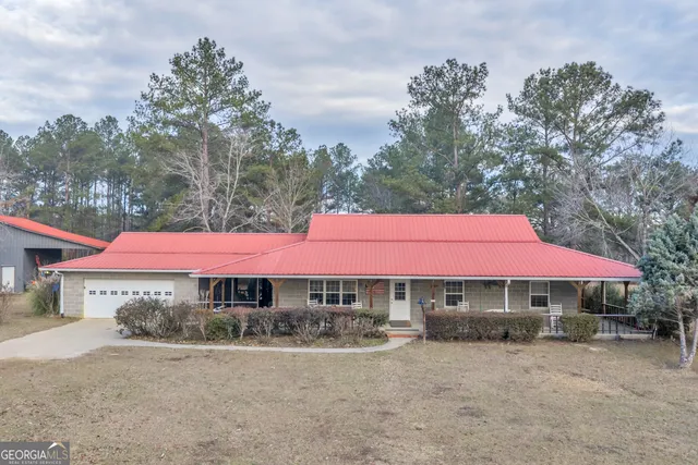 a bed room with a bed and a lamp