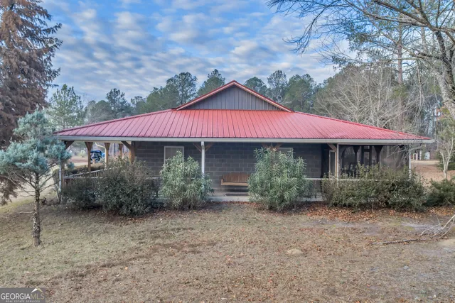 a bed room with a bed and a television