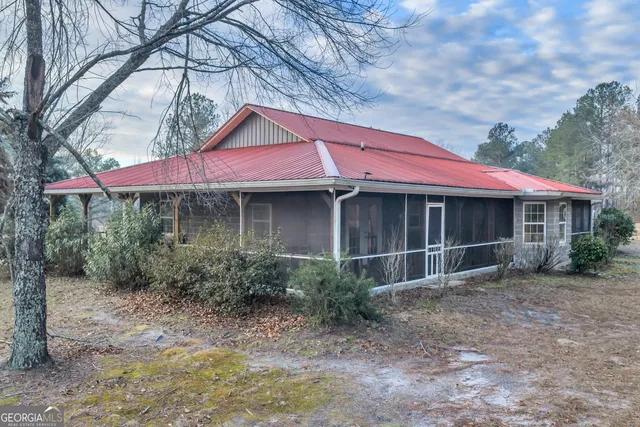 a bathroom with a sink toilet and mirror