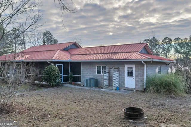a bathroom with a granite countertop sink mirror vanity and toilet