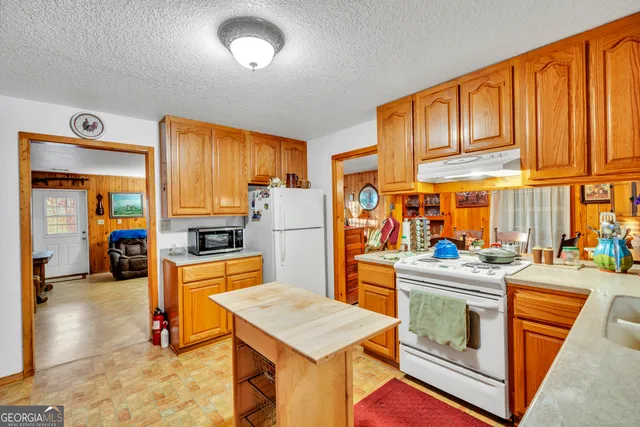 a yellow and red car parked in front of a building