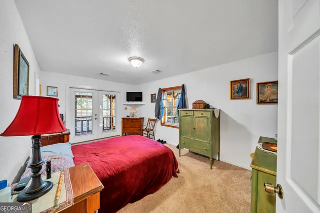 a view of a houses with a lush green forest