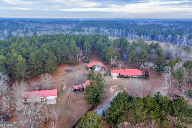 a kitchen that has a lot of cabinets in it and wooden floors
