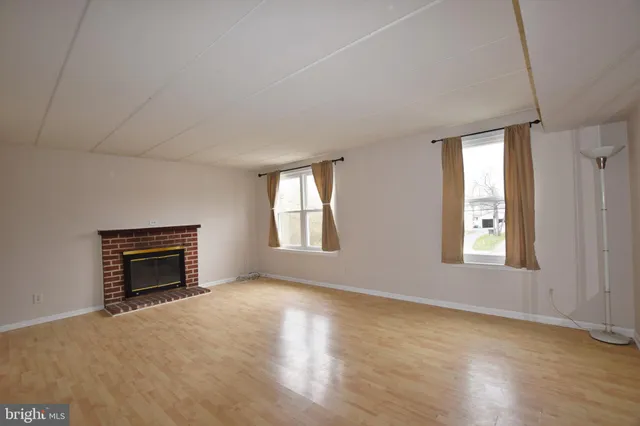 a kitchen with a refrigerator sink and cabinets