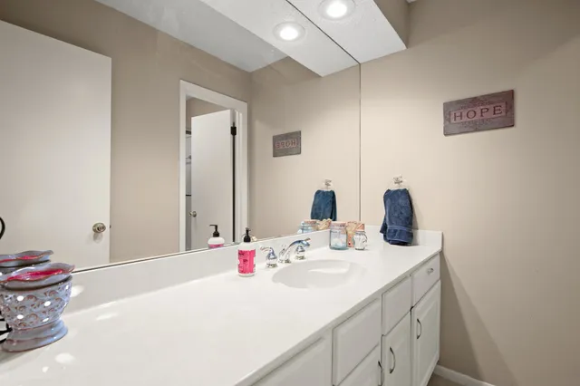 a bathroom with a sink and a mirror