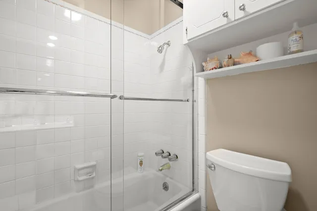 a bathroom with a shower and a toilet