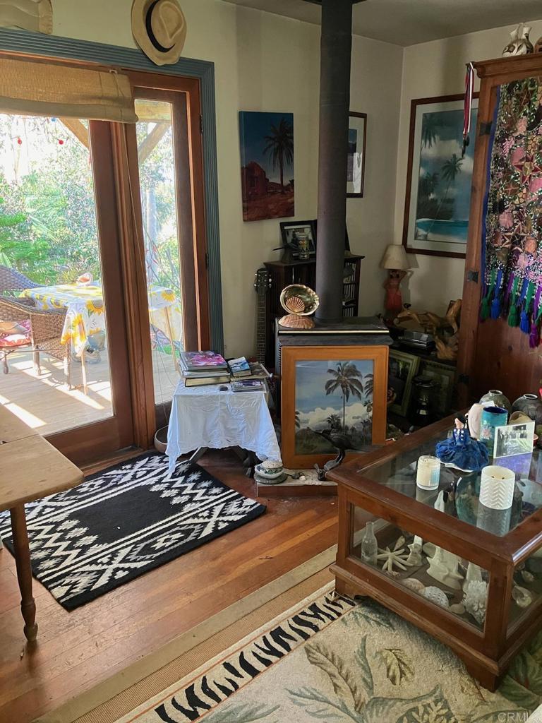 18525 Aliso Canyon Road Rancho Santa Fe, CA 92091 - Photo 13 of 16 a living room with furniture and a floor to ceiling window