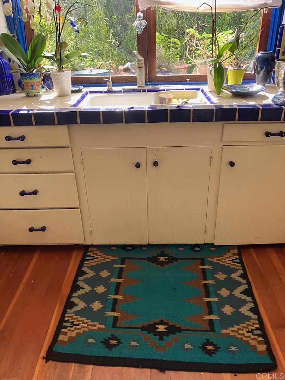 18525 Aliso Canyon Road Rancho Santa Fe, CA 92091 - Photo 15 of 16 a view of a sink a microwave and window