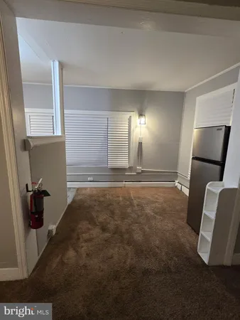 a view of a livingroom with a staircase