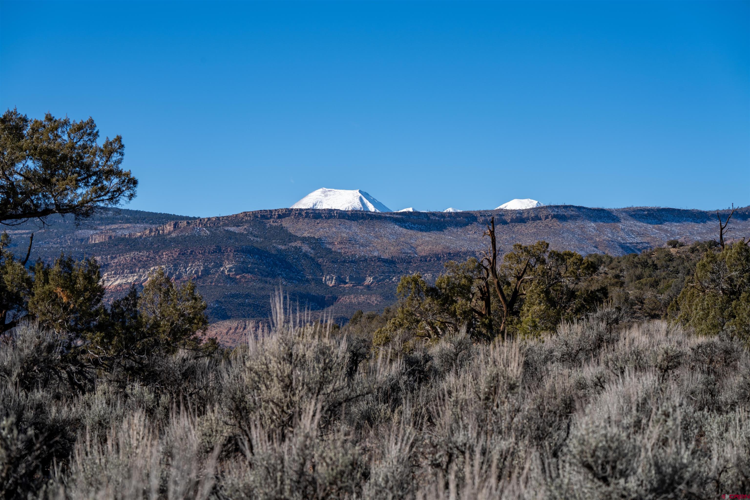 Tbd Na Road Paradox, CO 81429 - Photo 14 of 19 a view of a house with a mountain in the background