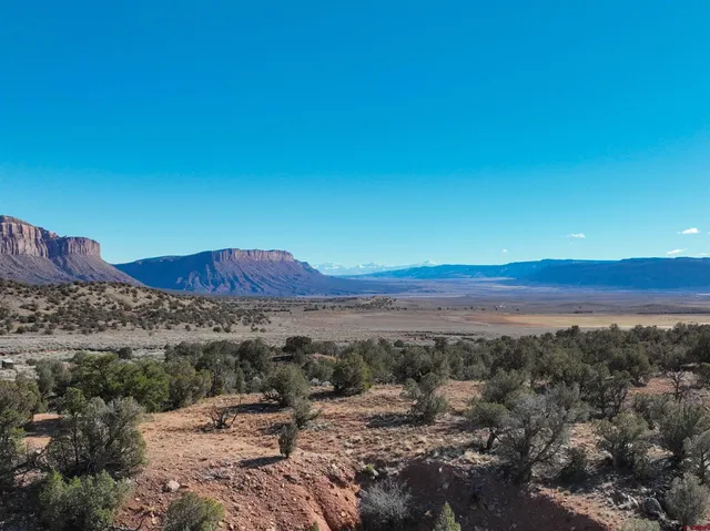 a view of a snow covered with snow in the background