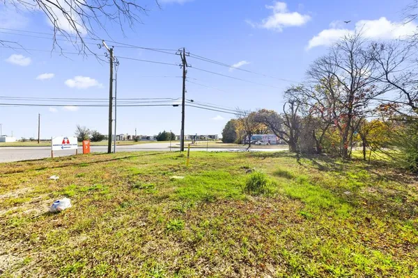 a view of an ocean with a floor to ceiling window